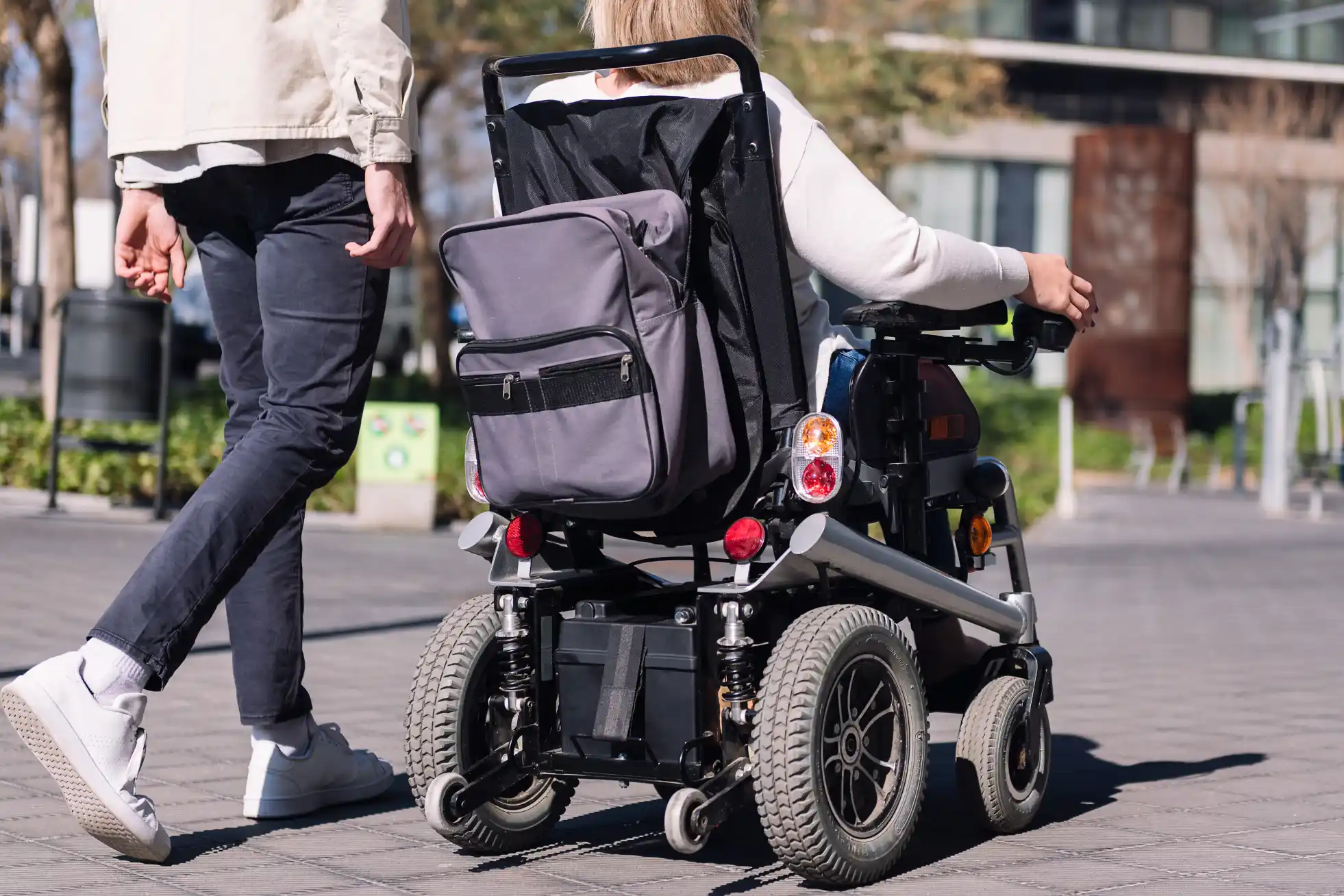 Occupational therapist performing a wheelchair seating assessment with a client